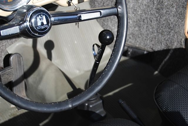 Steering wheel has a well fit cover. Shifter is the classic Trigger 